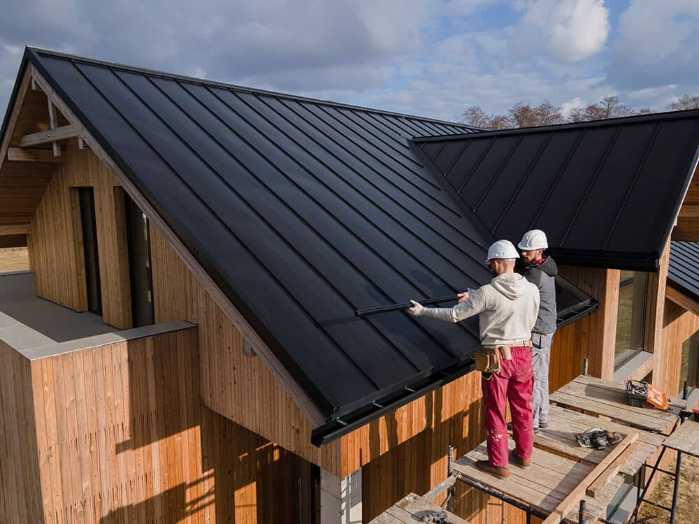 full-shot-roofers-working-together-with-helmets (1)